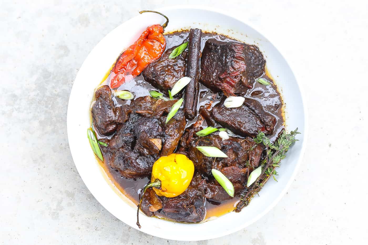 stewed beef pepperpot in white bowl