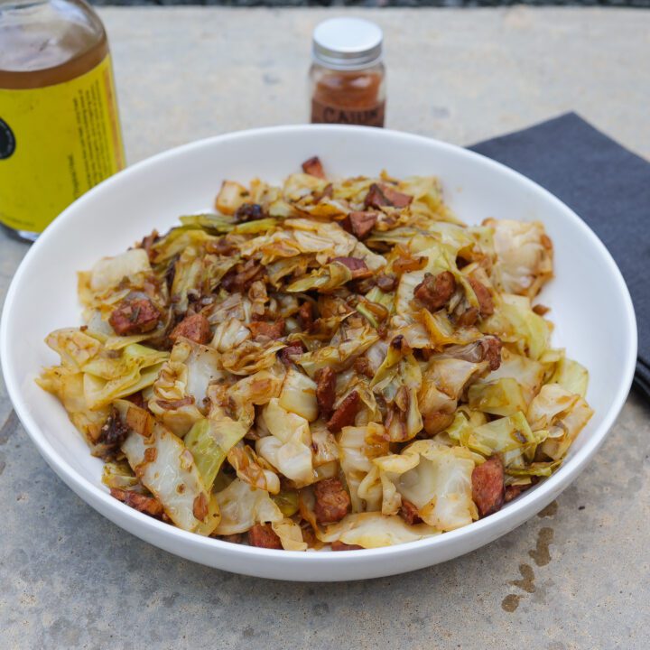 smothered cabbage in white pan