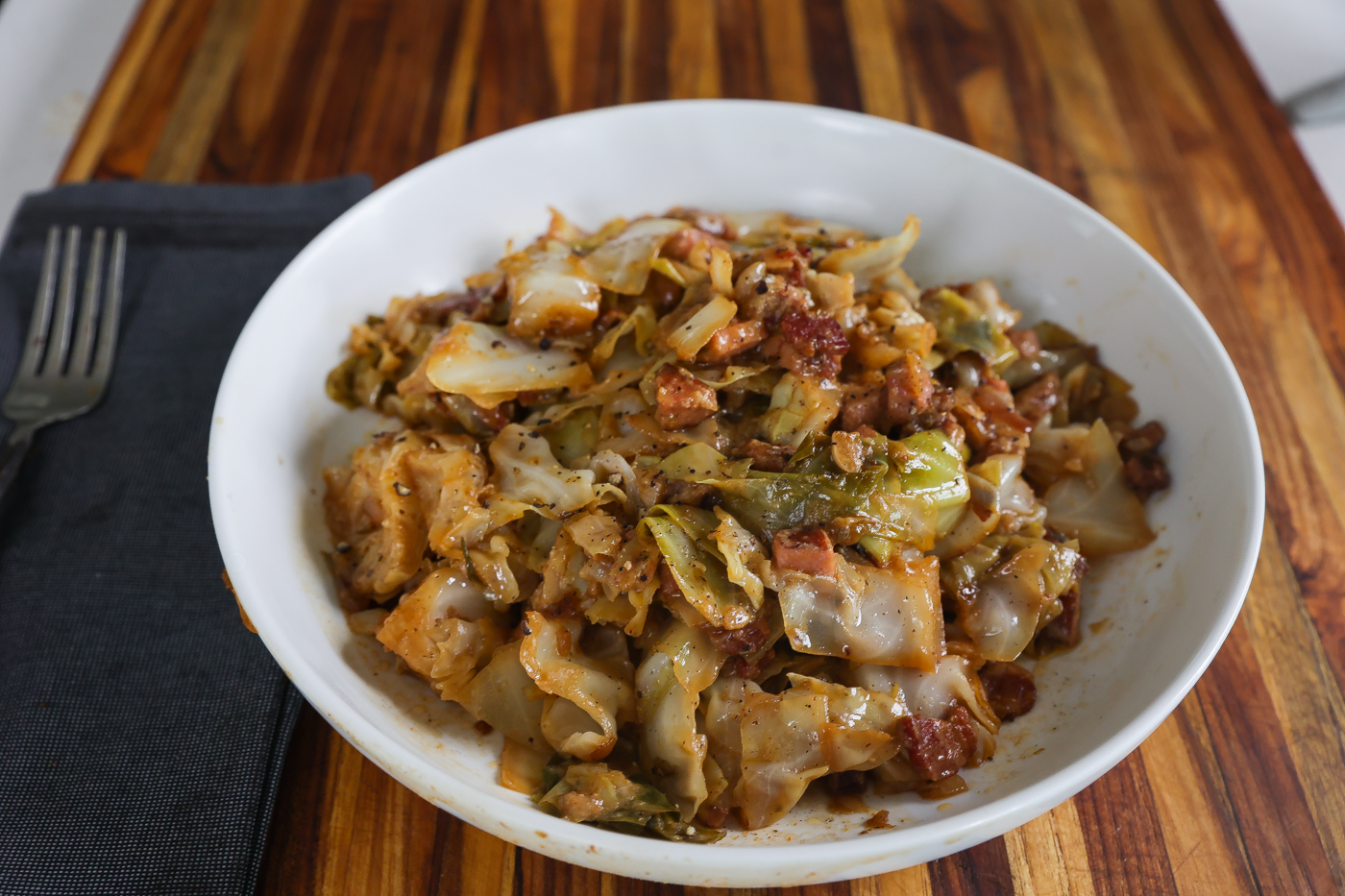 smothered cabbage in white pan