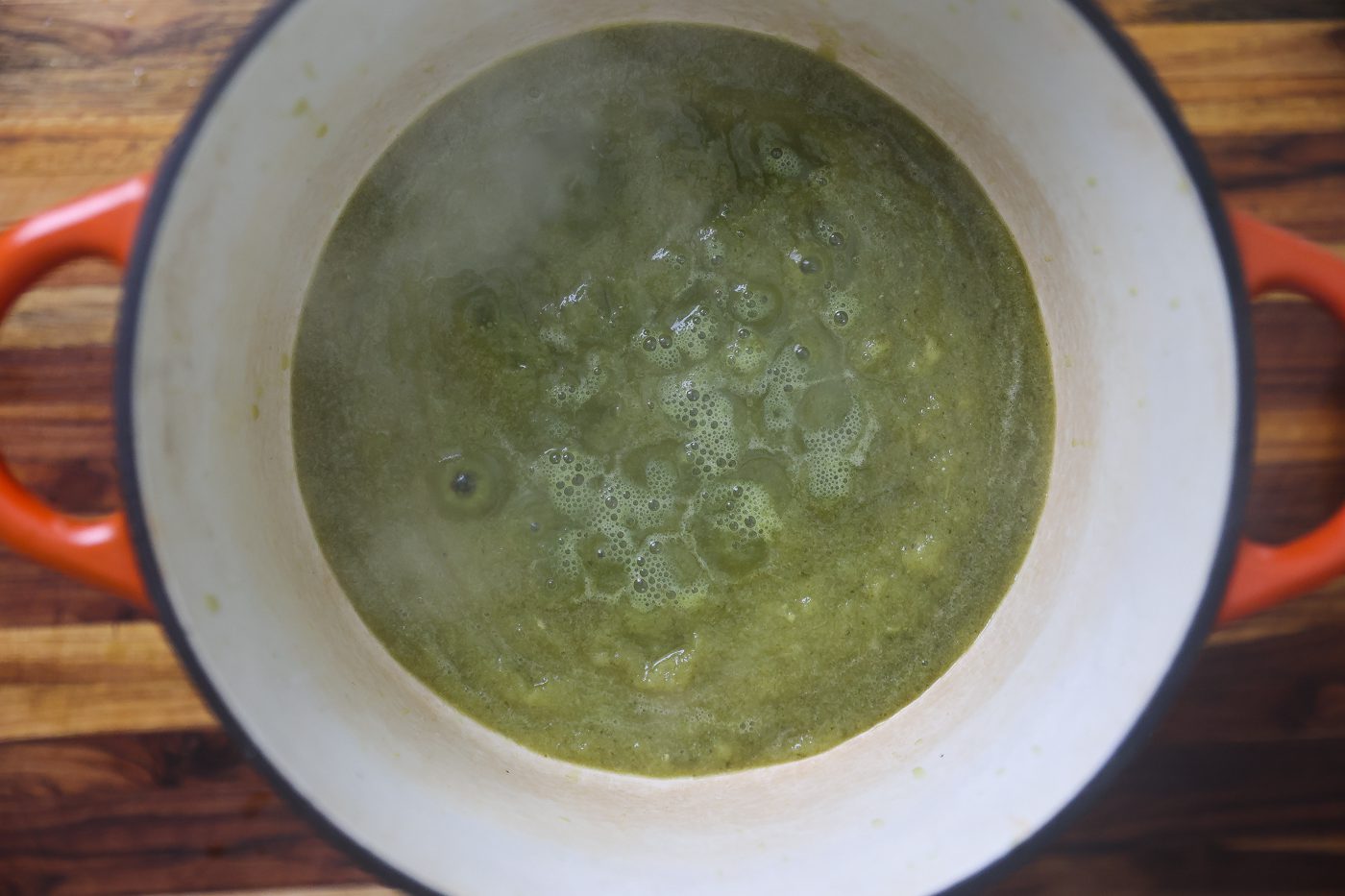 green sauce heating in pot