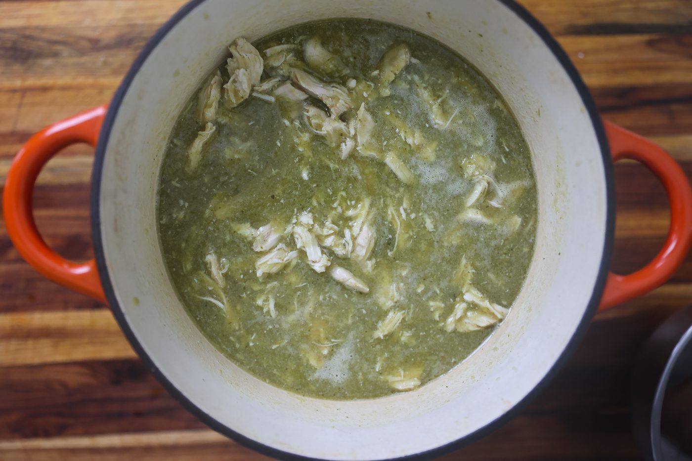 chicken stewing in green sauce