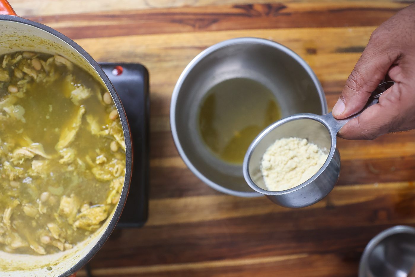 green chicken chili in orange pot