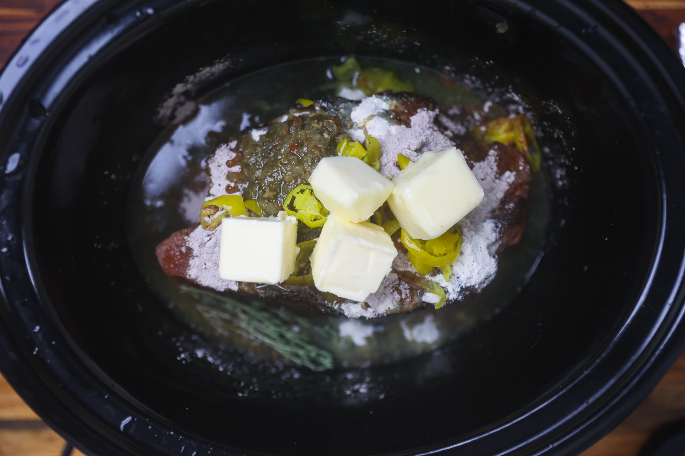 mississippi pot roast ingredients cooking in crock pot