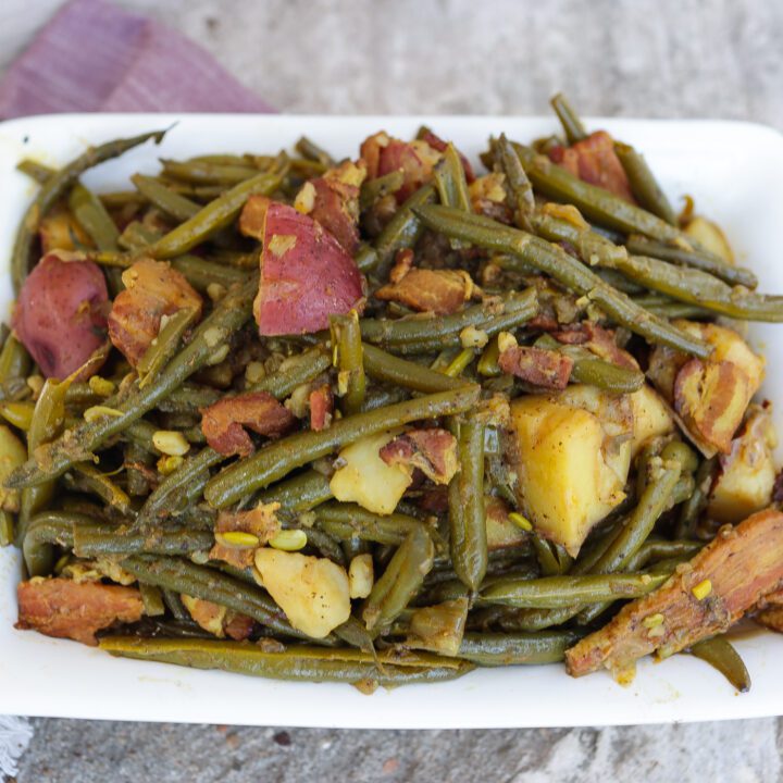 southern greens beans and potatoes in white pan