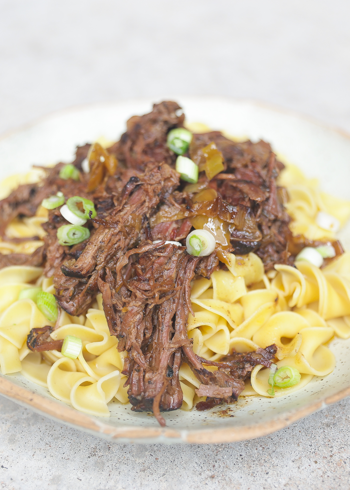 mississippi pot roast on top of egg noodles