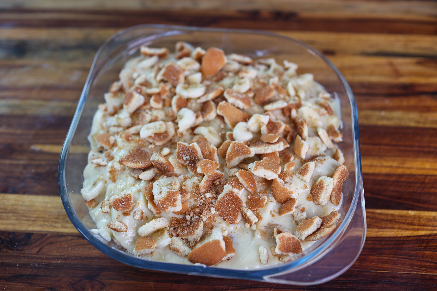 Old fashioned banana pudding layered in glass bowl