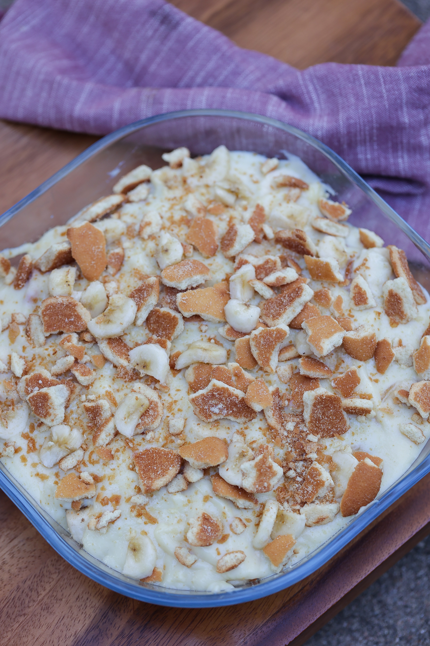 Old fashioned banana pudding layered in glass bowl