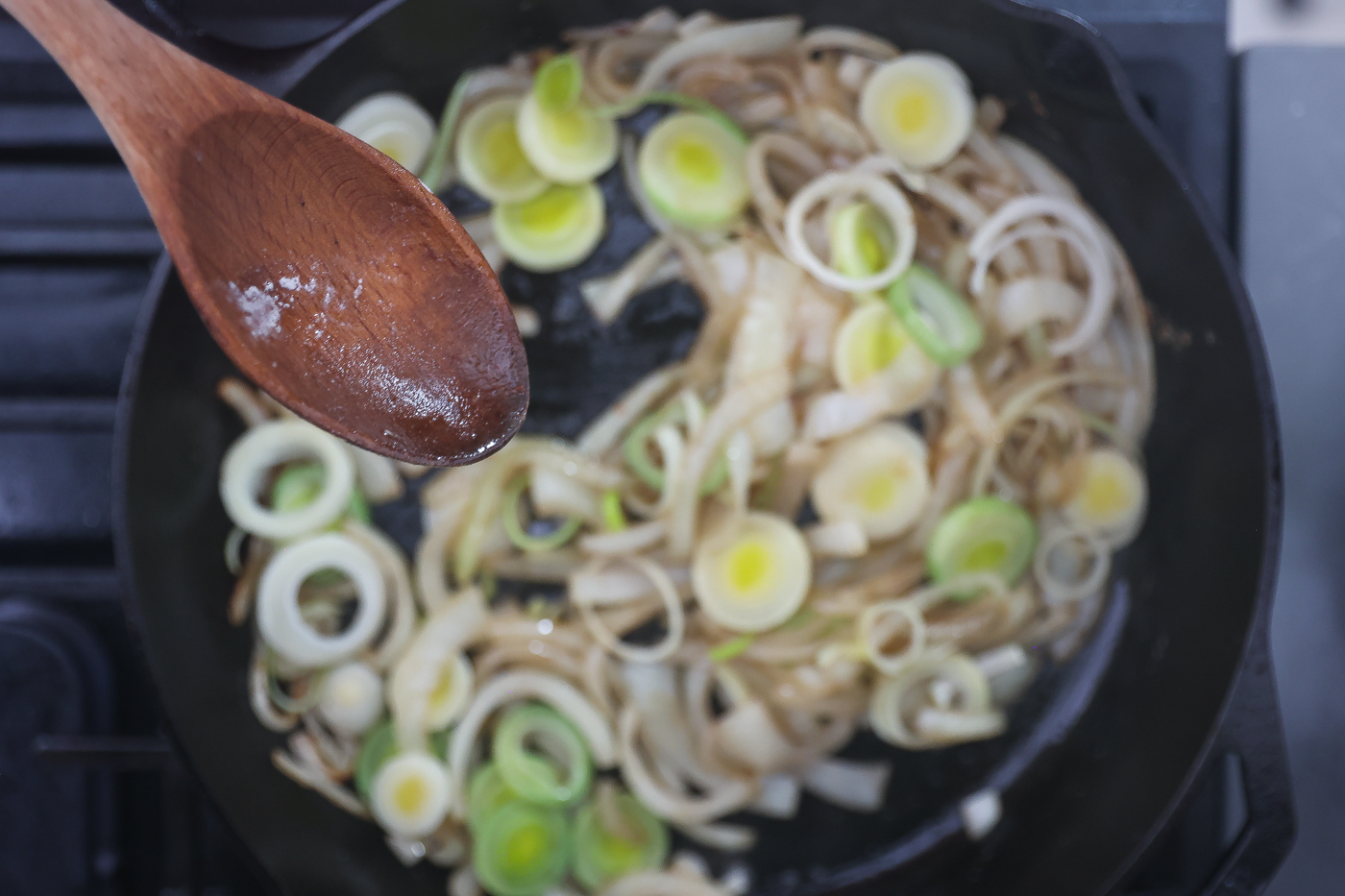 onions and leeks sauteing in skillet