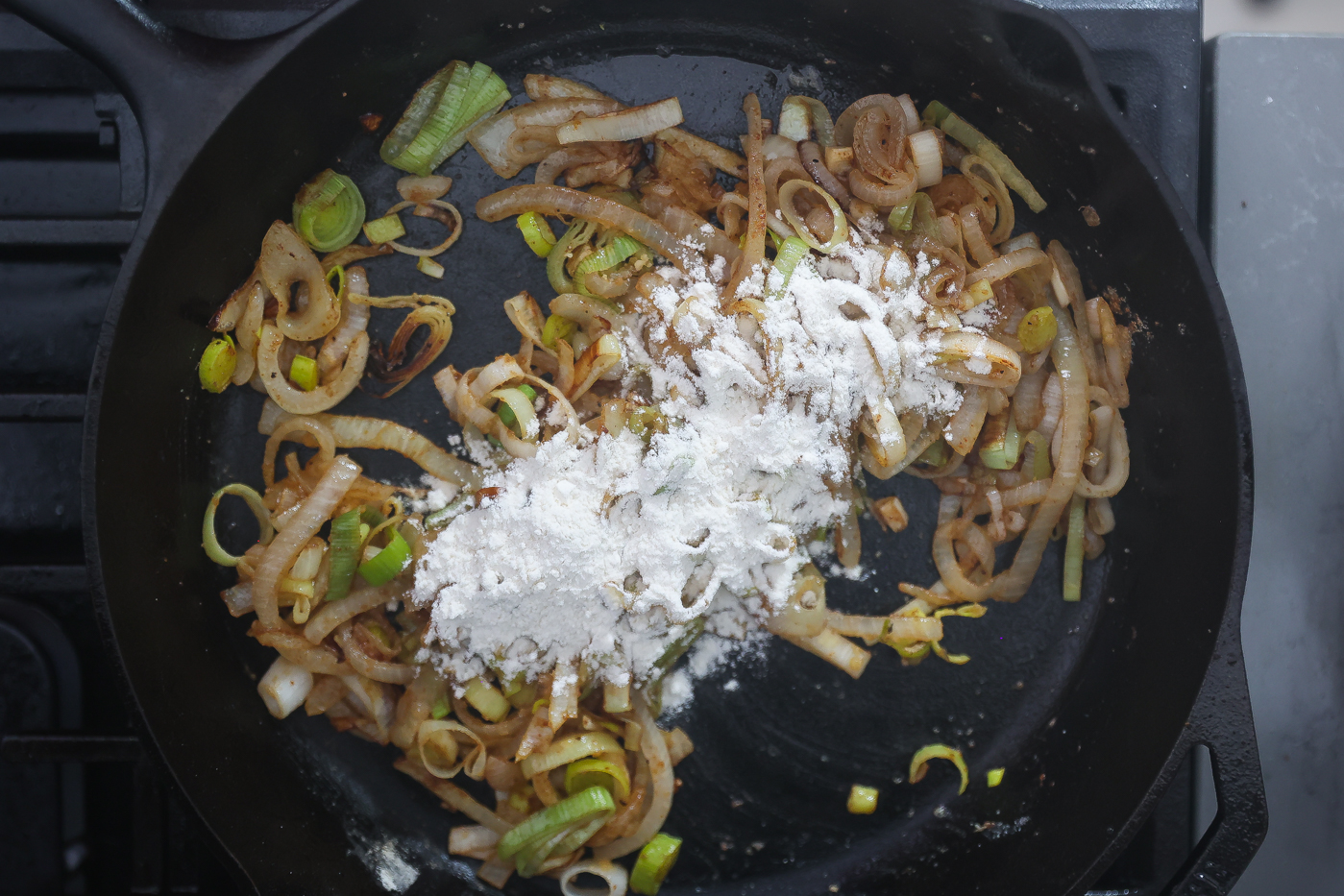 onions, leeks, and flour cooking in skillet