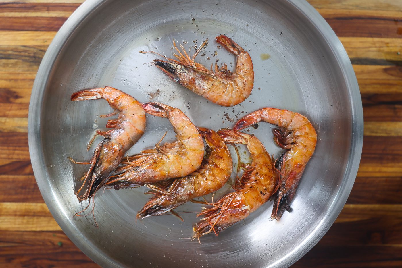 large shrimp cooking in skillet