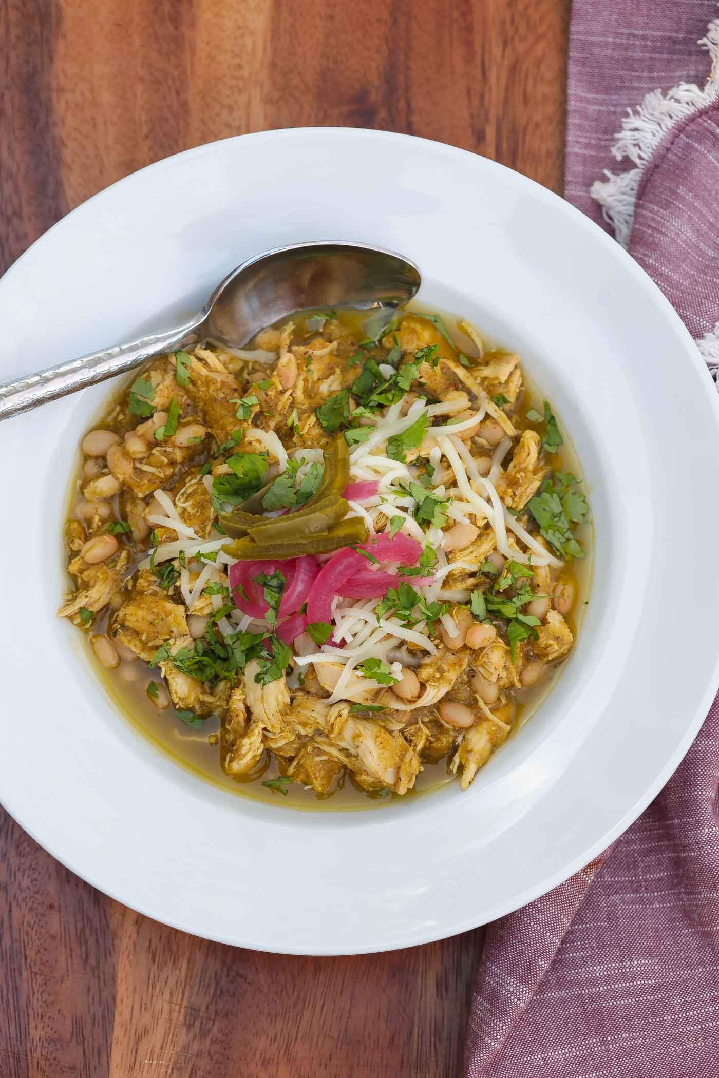 green chicken chili in a white bowl