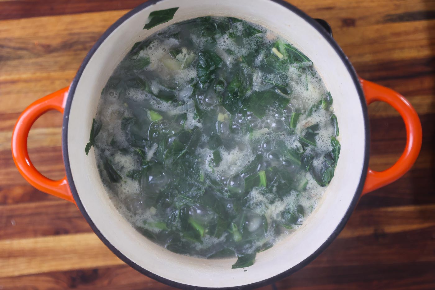 collard greens and spinach soup in a large pot