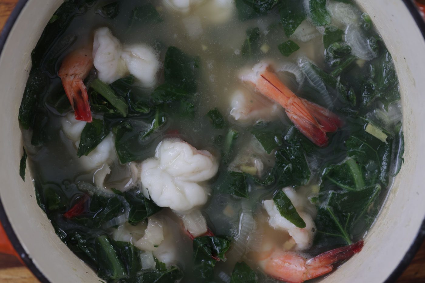 collard greens and spinach soup in a large pot